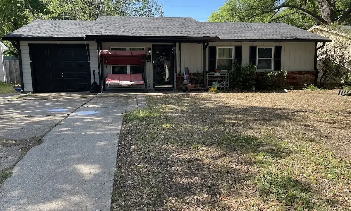 Wind Damage Roof Repair crew at work on a residential roof in Hinesville